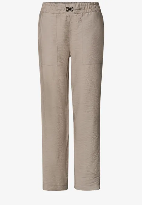 Beige lässige Hose mit geradem Schnitt und elastischem Bund.