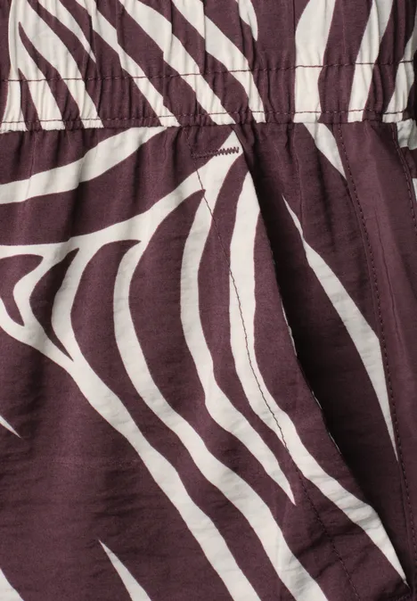 Close-up van bruin-witte stof met zebrapatroon.