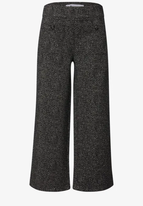 Schwarze, glitzernde, weit geschnittene Damenhose mit hohem Bund und weitem Bein.