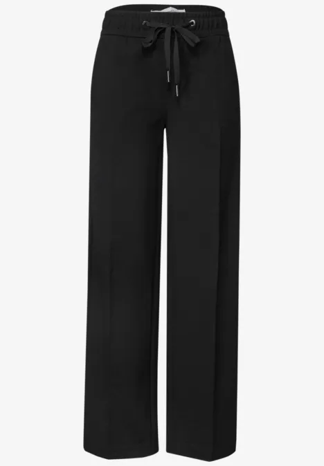 Zwarte, wijde broek met elastische taille en aantrekkoord voor een comfortabele, casual look.