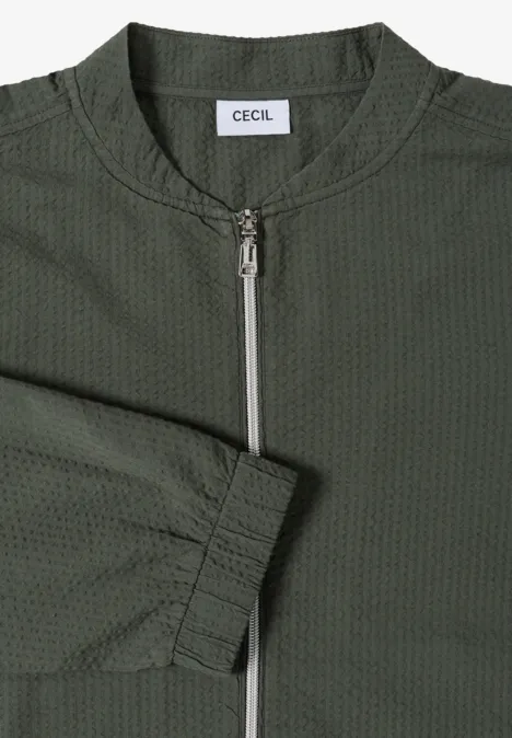 Khakigrüne Bomberjacke mit Reißverschluss und CECIL-Label.