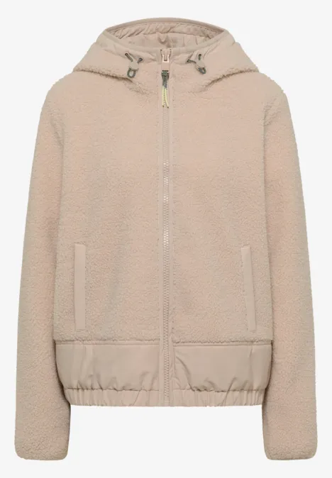 Beige teddyfleece-Kapuzenjacke mit Reißverschluss, Eingriffstaschen und elastischem Saum.