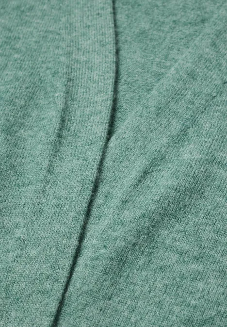 Langer Cardigan in offener Passform jewel green melange Grüner Stoff mit sichtbarer Naht in der Bildmitte.