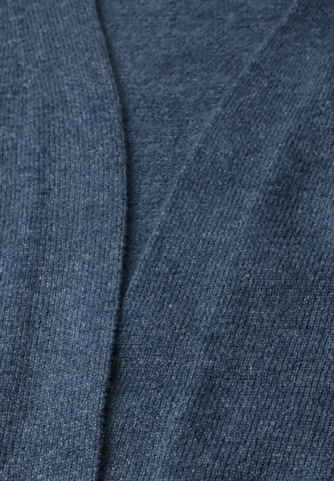 Cardigan long à la coupe ample cotton blue melange Gros plan d'un tissu tricoté bleu foncé à la texture douce.