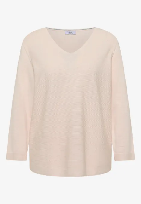Beiger V-Ausschnitt-Pullover mit langen Ärmeln, lockerer Passform aus weichem Strick.