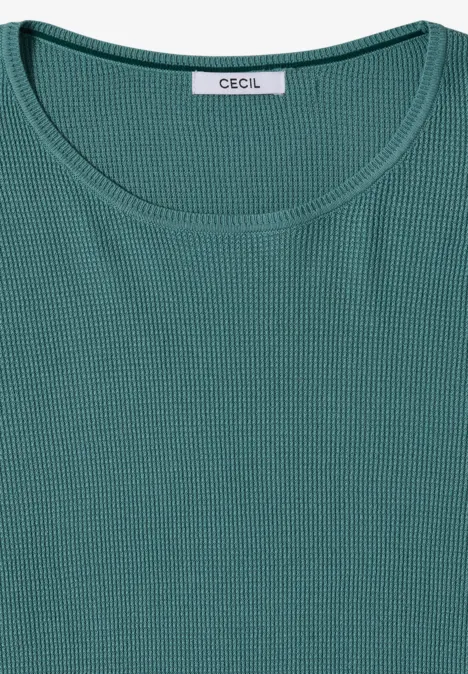 Dunkelgrünes, fein geripptes Damen-Shirt mit Rundhalsausschnitt, flach gefaltet.