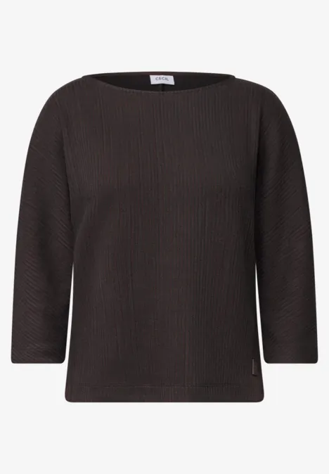 Dunkelgraues, fein geripptes Shirt mit Dreiviertelärmeln und rundem Ausschnitt.