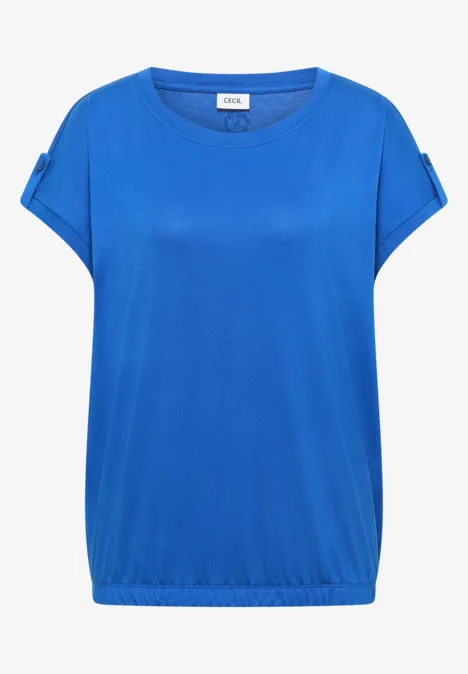 Top féminin ample bleu vif à manches retroussées, encolure ronde et taille élastiquée pour un style décontracté.