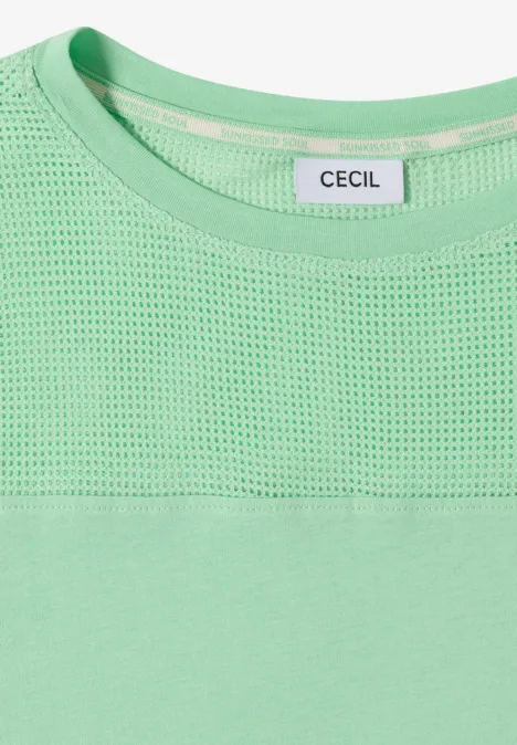 Lichtgroene top met mesh inzet bovenaan en CECIL-label bij de ronde hals.