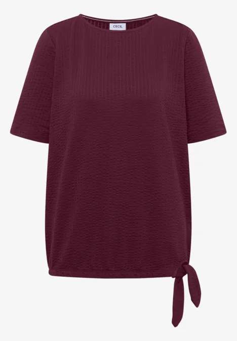 Bordeauxrood dames-T-shirt met korte mouwen, gestructureerde stof en een decoratieve knoop in de zoom.