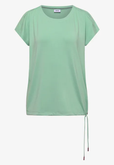 Los vallend lichtgroen T-shirt met doorlopende mouwen en een verstelbaar koord aan de zijkant