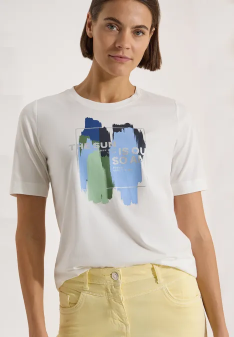 T-shirt blanc pour femme avec motif abstrait de coups de pinceau verts et bleus.