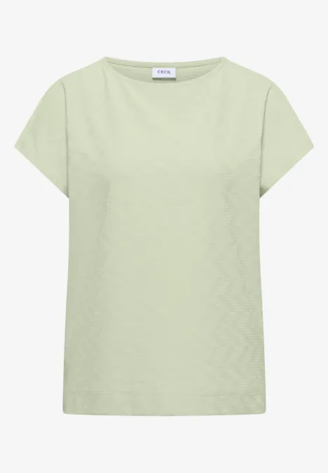 T-shirt uni vert pâle à manches courtes et encolure ronde.