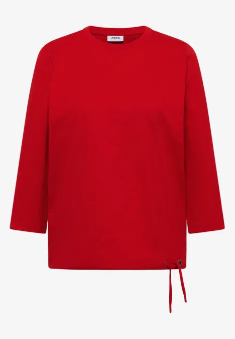 Rotes, locker geschnittenes Langarmshirt mit Seitenschnüren am Saum.