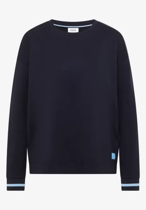 T-shirt à manches longues, col rond et rayures urban dark blue Ein schlichtes, dunkelblaues Sweatshirt mit Rundhalsausschnitt, langen Ärmeln und gestreiften Bündchen.