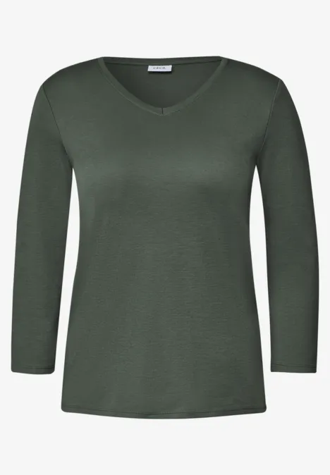 Ein schlichtes, dunkelgrünes Damen-Shirt mit V-Ausschnitt und langen Ärmeln.