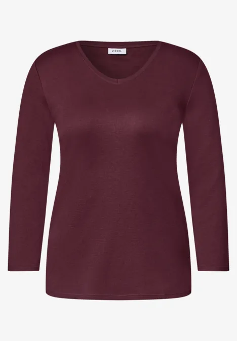 Un haut femme uni à manches longues et encolure en V, couleur bordeaux.