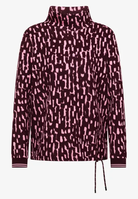 Rollkragenpullover mit dunkelrotem Grund, rosa abstraktem Tupfenprint und seitlichem Tunnelzug