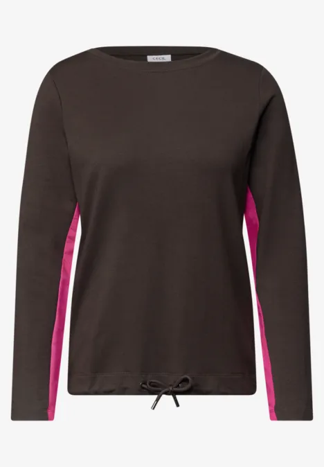 T-shirt à manches longues noir avec empiècements roses sur les côtés et cordon de serrage à l'ourlet.