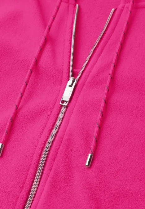 Langarm Fleece Jacke mit Kapuze pink flash Nahaufnahme eines pinken Kleidungsstücks mit silbernem Reißverschluss und Kordeln.