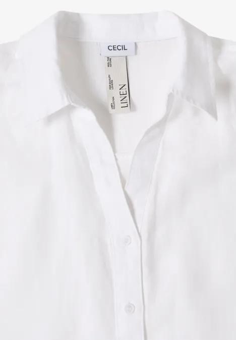 Witte linnen blouse met klassieke kraag en knoopsluiting, merklabel 'Cecil' aan de binnenkant.