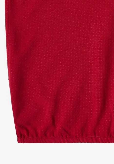 Rode meshstof met fijne netstructuur en elastische zoom onderaan.