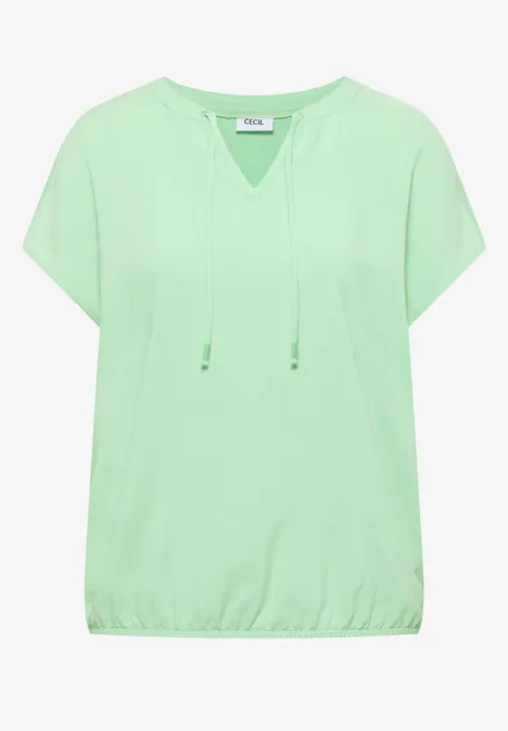 Lichtgroen, losvallend T-shirt met korte mouwen, koordsluiting bij de hals en elastische zoom.