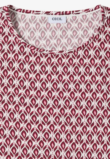 Top sans manches rouge à motif géométrique blanc en losanges