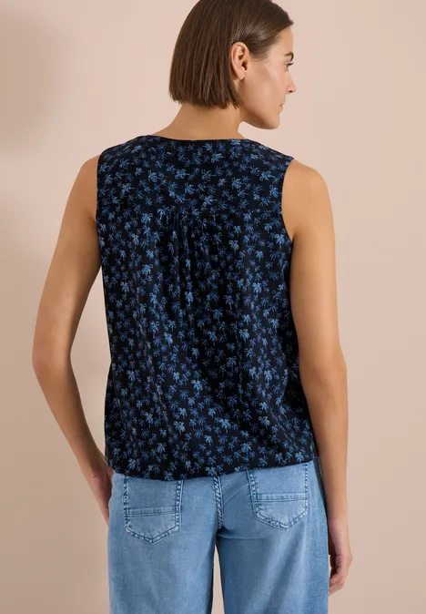 Losvallende dames top mouwloos donkerblauw met blauw bloemenpatroon.