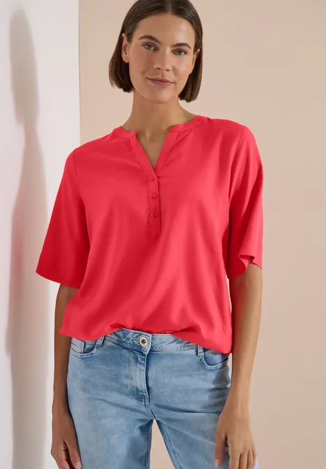 Blouse met korte mouwen en gespleten hals coral Blouse met korte mouwen en gespleten hals coral
