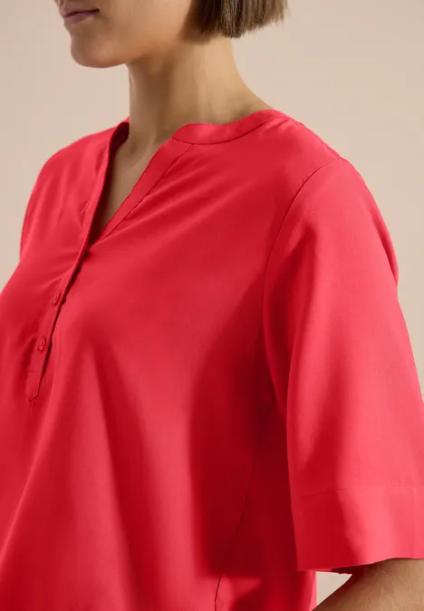 Blouse met korte mouwen en gespleten hals coral Blouse met korte mouwen en gespleten hals coral