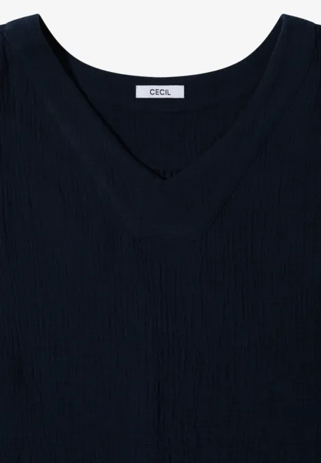 Schlichtes schwarzes ärmelloses Top mit V-Ausschnitt und dezitem Label innen.