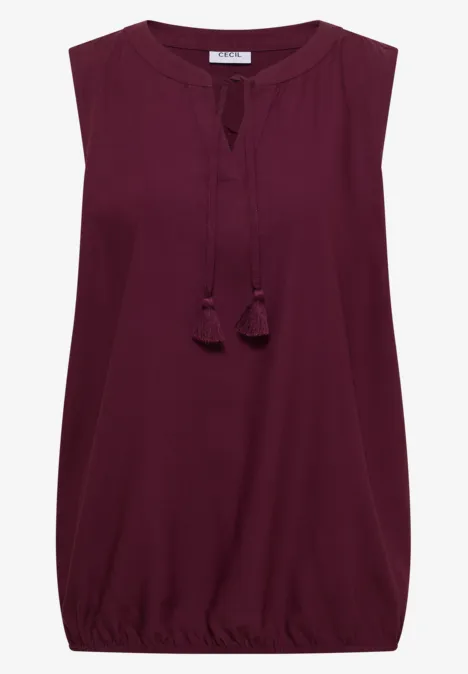 Haut sans manches bordeaux à col en V orné de pompons et ourlet légèrement froncé