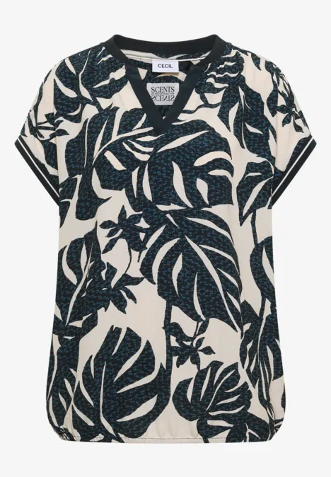 Blouse met gespleten hals en printmix palm breeze green Witte en blauwe damesblouse met V-hals en tropische bladprint.