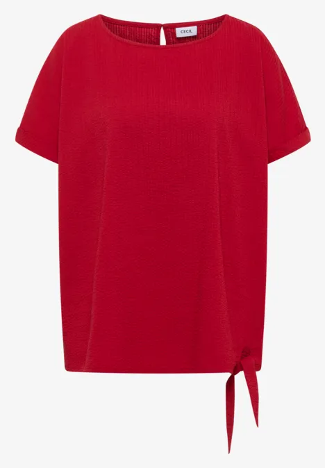 Rotes Kurzarmshirt mit Rundhals und seitlicher Knotenverzierung am Saum.
