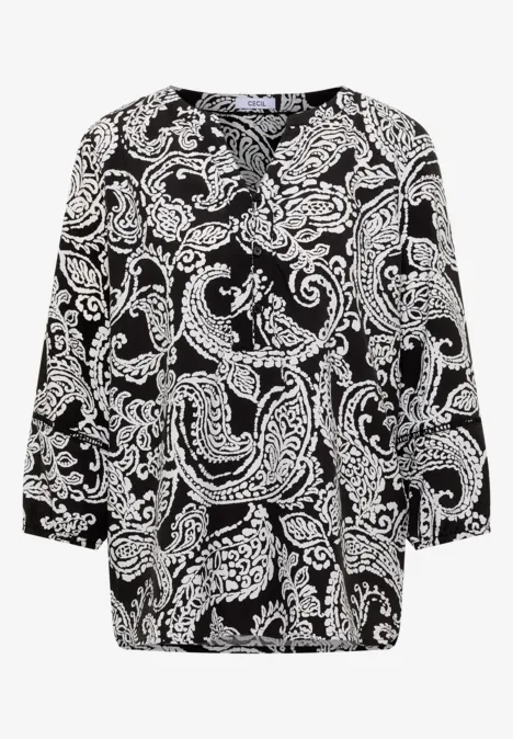 Blouse noire à motifs cachemire blancs et manches 3/4