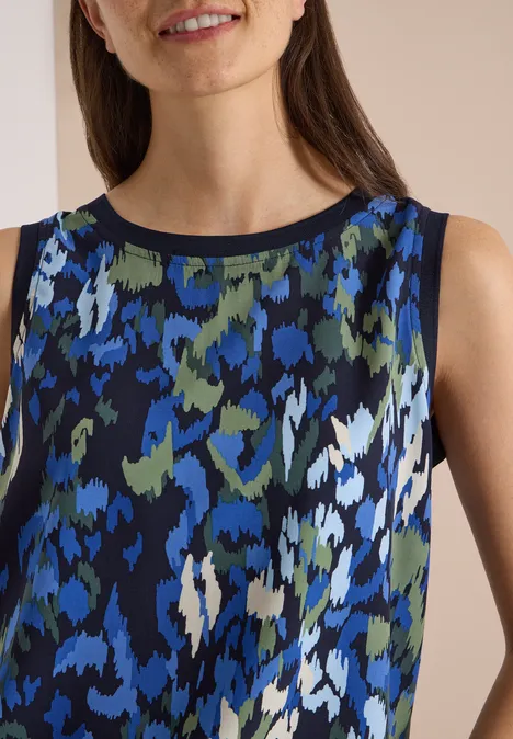 Ärmelloses Damen-Top mit abstraktem blau-grün-weißem Muster und schwarzem Rundhalsausschnitt.