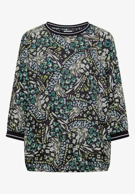 Damenbluse mit buntem Blumen- und Vogelprint, 3/4-Ärmel, Kontraststreifen an Bündchen und Kragen.