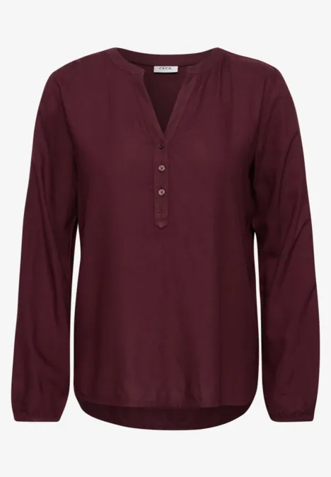 Dunkelrotes, langärmeliges Damen-Blusenshirt mit V-Ausschnitt und Knopfleiste, lockere Passform.