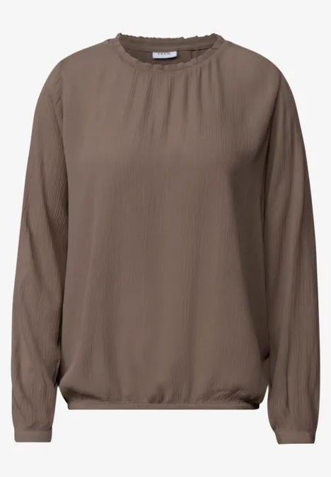 Braune, langärmlige Bluse mit Rundhalsausschnitt, lockerem Schnitt und elastischem Saum und Bündchen.