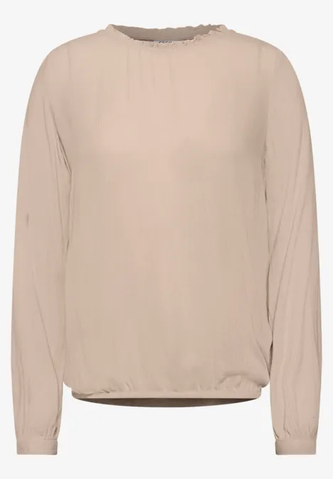 Beige Langarm-Bluse mit rundem Ausschnitt und lockerem Schnitt.