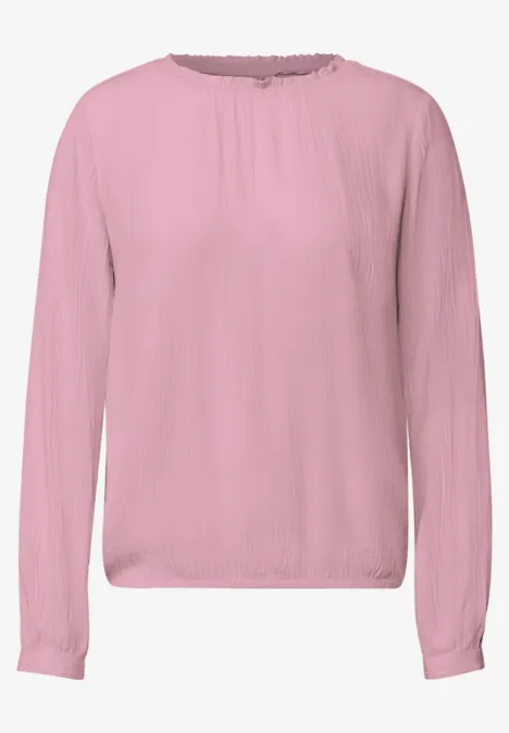 roze blouse met lange mouwen, ronde hals en eenvoudig ontwerp