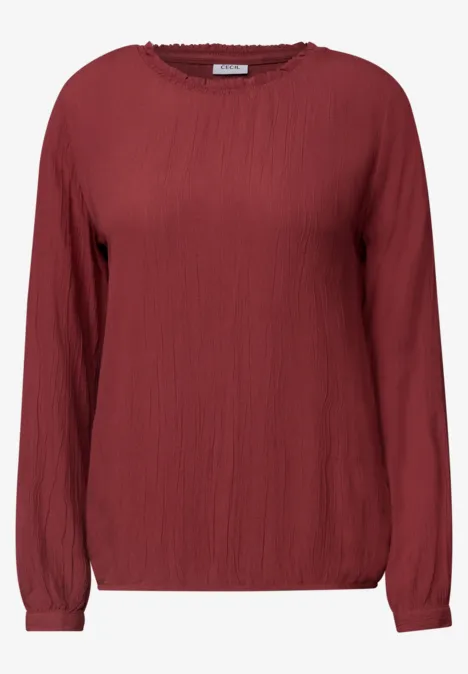Langarm Bluse mit Rundhals und Smokdetail russet red Rote, langärmlige Bluse mit lockerem Schnitt und strukturierter Oberfläche.