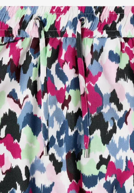 Pantalon coloré à motif abstrait avec cordon à la taille.
