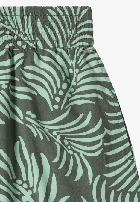 Maxirok met bladmotief khaki Groene rok met elastische tailleband en tropisch bladerenpatroon in licht- en donkergroen.