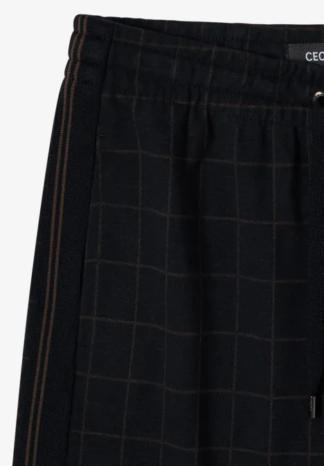 Zwarte joggingbroek met ruitpatroon, elastische tailleband en zijzak.