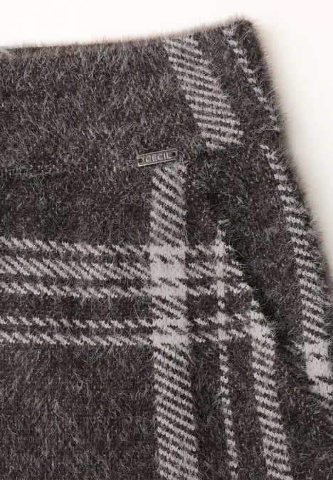 Close-up van grijze wollen stof met wit ruitmotief en stiksels