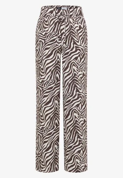 Pantalon à motif zèbre noir et blanc, coupe droite et taille haute.