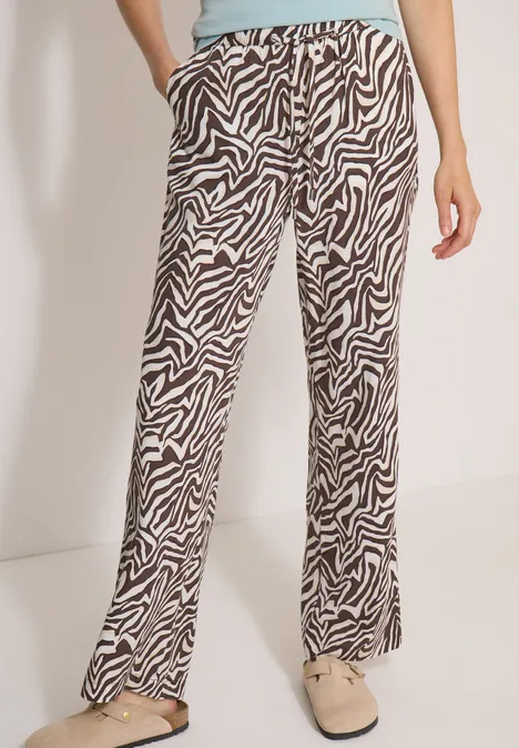 Pantalon ample à motif zèbre noir et blanc, taille élastique, coupe décontractée.