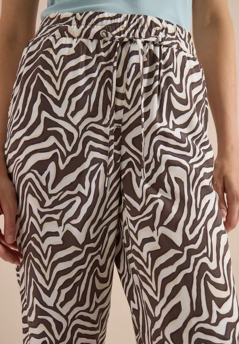 Pantalon ample à motifs zèbre noir et blanc, taille élastique avec cordon.